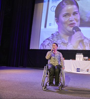 Sofie Cox - Speaking on stage in the wheelchair
